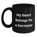 Funny Surveyor Gifts for Men, My Heart Belongs To A Surveyor Black Coffee Mug, Unique Birthday Unique Gifts from Friends - Main