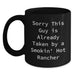 Funny Rancher Gifts for Men from Coworkers - Sorry 'This Guy Is Already Taken By A Smokin' Hot Rancher' Black Coffee Mug, Graduation Unique Gifts - Main