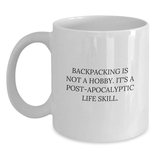 Funny Backpacking Gifts for Men from Friends - 'Backpacking Is Not A Hobby. It's A Post-apocalyptic Life Skill.' - White Coffee Mug - Main