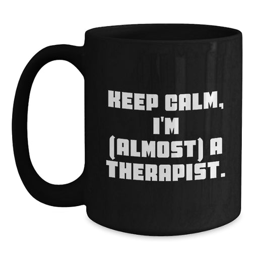 Funny Therapist Gifts from Friends for Graduation Unique Black Coffee Mug - 'Keep Calm, I'm almost A Therapist.' - Main