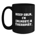 Funny Therapist Gifts from Friends for Graduation Unique Black Coffee Mug - 'Keep Calm, I'm almost A Therapist.' - Main