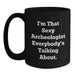 Funny Archeologist Gifts for Men, Women, Friends, Coworkers, Family - 11oz or 15oz Black Coffee Mug 'I'm That Sexy Archeologist Everybody's Talking About.' - Main