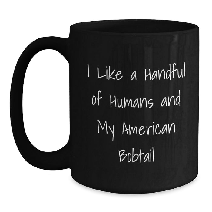 Funny American Bobtail Cat Gifts for Men, Unique Black Coffee Mug from Friends with I Like A Handful Of Humans - Main