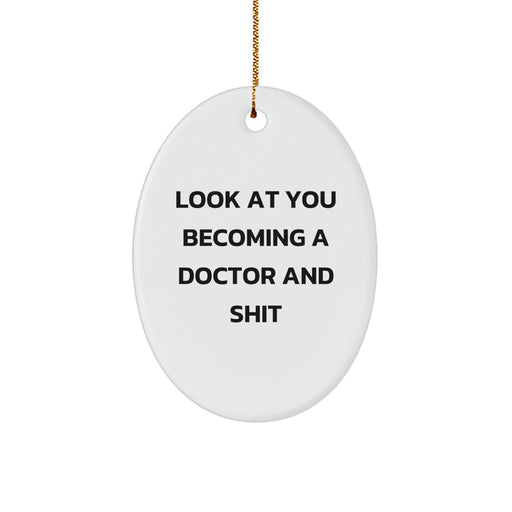 Funny Doctor Gifts for Him from Friends, Gifts for Doctor Christmas Unique Oval Ornament with 'Look At You Becoming A Doctor And Shit', White Oval Shaped, Perfect for Office or Home Decoration - Image 1